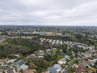 Aerial view of Balboa neighborhood with houses and residential condos during clouded day in San Diego, California, USA.