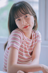 Naklejka premium Portrait of young Asian woman with fragile beauty