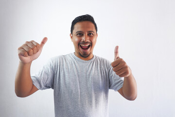 Fototapeta premium happy man showing two thumbs up and smile at camera