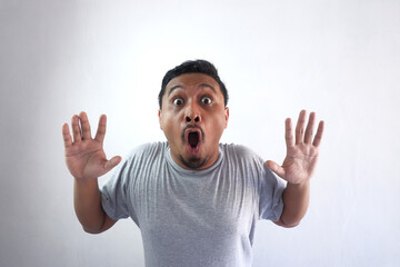 Fototapeta premium shocked face expression of man looking at camera