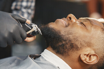Young African-american man visiting barbershop
