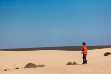 Fototapeta na wymiar person walking in the desert