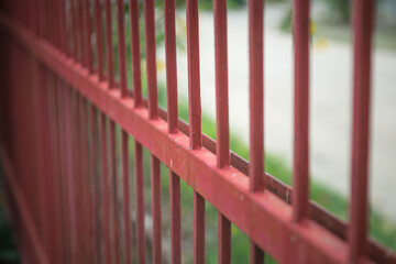 Red iron fence blur background image