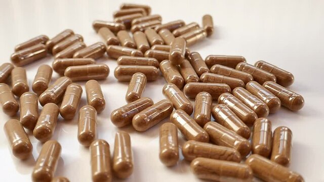 Guarana capsules on a white background. Natural energetic. Guarana powder capsules.super food.  Vitamins and dietary supplements.