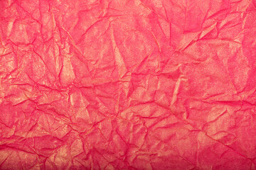 Fototapeta premium Pink crumpled paper texture or background.
