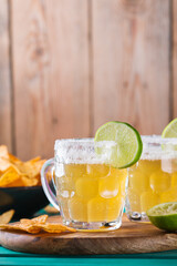 Mexican alcohol cocktail chelada with light beer and lime juice