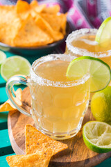 Mexican alcohol cocktail chelada with light beer and lime juice