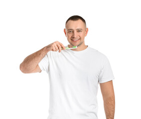 Man with tooth brush on white background