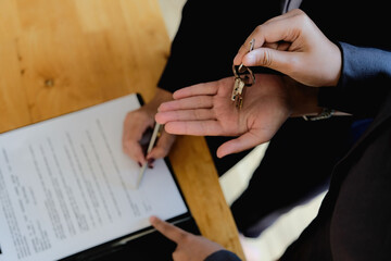 Real estate agent offer hand for customer sign agreement contract signature for buy or sell house....