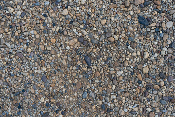 Colorful sand or pebble texture. Seamless texture on ground texture.