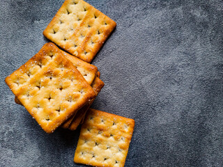 Stack of Sweet Crunchy Crackers isolated on abstract background. Flat Lay.