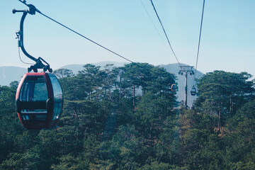 Circulating cable car between Dalat bus station and Robin Hill Truc Lam Vietnam. Intermediate...