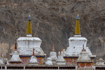 White buddhist stupa or pagoda in tibetan monastery near village Leh in ladakh, noth India