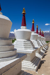 White buddhist stupa or pagoda in tibetan monastery near village Leh in ladakh, noth India