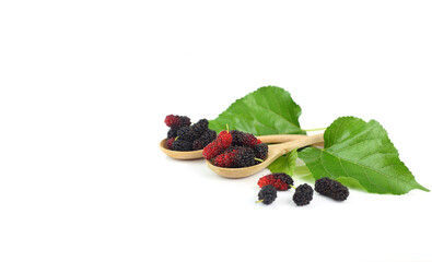 Healthy fruit - mulberry on wooden spoon with green leaves isolated on white
