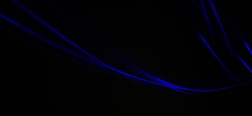 Closeup of Neon blue Spirograph geometric abstract pattern flowing in a isolated black background . Made using Long exposure technique, Light painting. Pendulum pattern. © sanju's view