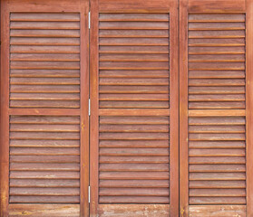 Old wooden windows frame on stone wall in Spain. Close up