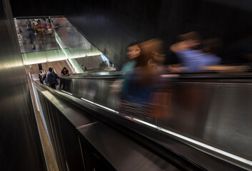 people on a escalator staircase
