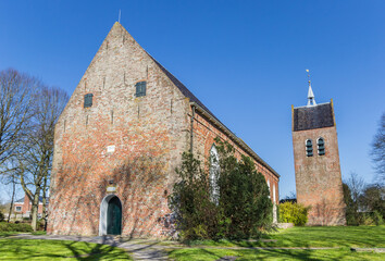 Fototapeta na wymiar Church and tower in the historic village Baflo