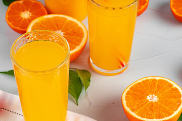 Orange juice cup on table close up