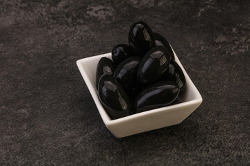 Pickled black olives in the bowl