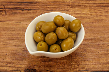 Green pickled olives in the bowl