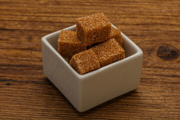 Cane sugar cubs in the bowl