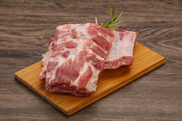 Fototapeta premium Raw pork ribs served rosemary