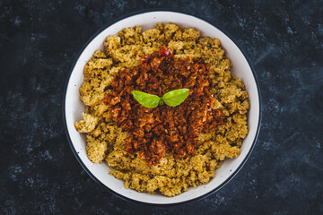 vegan bolognaise couscous with plant-based mince sauce, healthy plant-based food