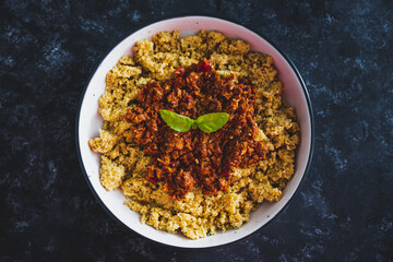 vegan bolognaise couscous with plant-based mince sauce, healthy plant-based food