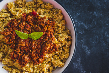 vegan bolognaise couscous with plant-based mince sauce, healthy plant-based food