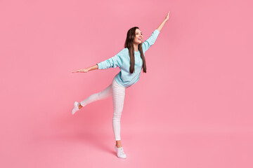 Fototapeta na wymiar Full size profile photo of adorable funny lady arms flying look empty space isolated on pink color background