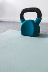 Naklejka na ściany i meble home gym with mixed fitness items including yoga mat and kettlebell