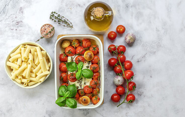 Trending viral Feta baked pasta recipe made of cherry tomatoes, feta cheese, garlic, and herbs in a...