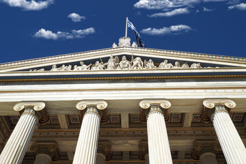 Beautiful neoclassic Academy of Athens public landmark building with beautiful spring clouds and...