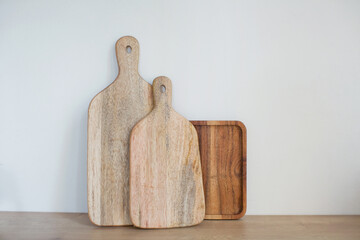 Various wooden cutting boards on kitchen