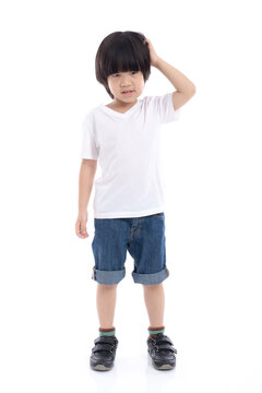 Asian child scratching his head on white background isolated