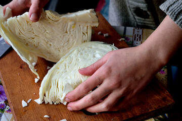 slicing white cabbage for salad, close-up