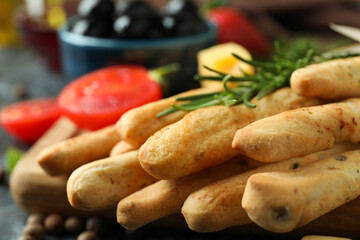 Tasty grissini sticks and snacks, close up