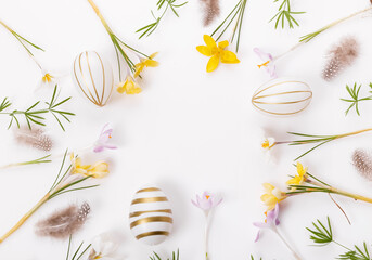 Easter floral background, easter eggs end spring flowers crocus decorated with natural botanical elements, flat lay, blank space for greeting text