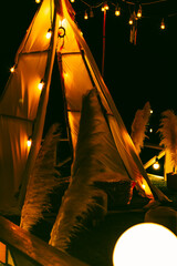 Red Indian style Teepee tent in the nature. © Thasist