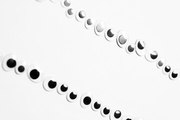 Parallel lines from toy eyes on white background