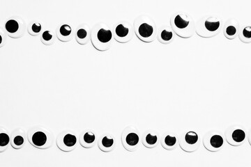 Parallel lines from toy eyes on white background