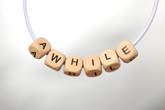 Word awhile lined with wooden cubes