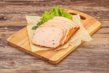 Boiled pork sausage over board