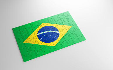 A jigsaw puzzle with a print of the flag of Brazil, pieces of the puzzle isolated on white background. Fulfillment and perfection concept. Symbol of national integrity. 3D illustration.
