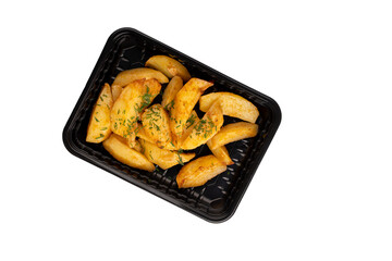 Lunch box with tasty potato wedges. Food delivery. Top view. Isolated. Rustic potato.