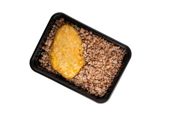 Lunch box with buckwheat porridge and chicken cutlet. Food delivery. Top view. Isolated.