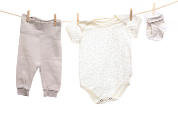 Baby clothes on a clothesline on white  background