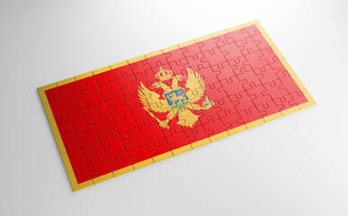Fototapeta na wymiar A jigsaw puzzle with a print of the flag of Montenegro, pieces of the puzzle isolated on white background. Fulfillment and perfection concept. Symbol of national integrity. 3D illustration.